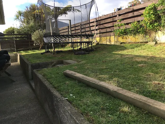 Tiered garden section mowed by Pasturesnz